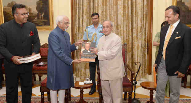 Pranab Mukherjee receiving the first copy of the book "The Education President" from the Vice President, M. Hamid Ansari, at the Rashtrapati Bhavan, in New Delhi on June 08, 2016.