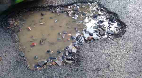 Political and bureaucratic corruption is the main cause of broken roads in Delhi. Photo: Rakesh Raman