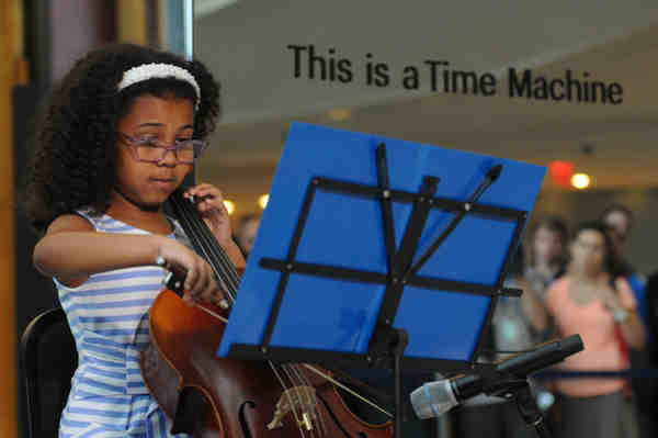 On 14 September 2016, nine-year-old Cellist Emerson Davis plays the cello during a performance at the launch of UNICEFs Time Machine