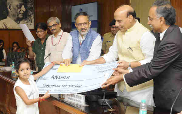 The Union Home Minister, Shri Rajnath Singh distributing the scholarship cheques to the school going children of Central Armed Police Forces (CAPFs) and Assam Rifles (AR) personnel, who sacrificed their lives in the service of the nation, at a function, in New Delhi on August 27, 2018. The Union Home Secretary, Shri Rajiv Gauba is also seen.