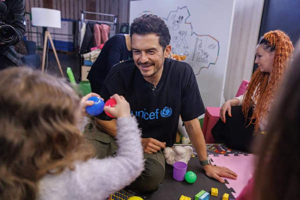 UNICEF Goodwill Ambassador Orlando Bloom plays with children in the UNICEF Spilno Child Spot at a metro station in Kyiv, Ukraine on 25 March 2023. Photo: UNICEF